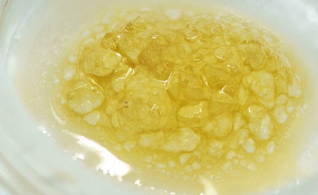 yellow-ish sauce concentrate, with clear crystals in terp sauce