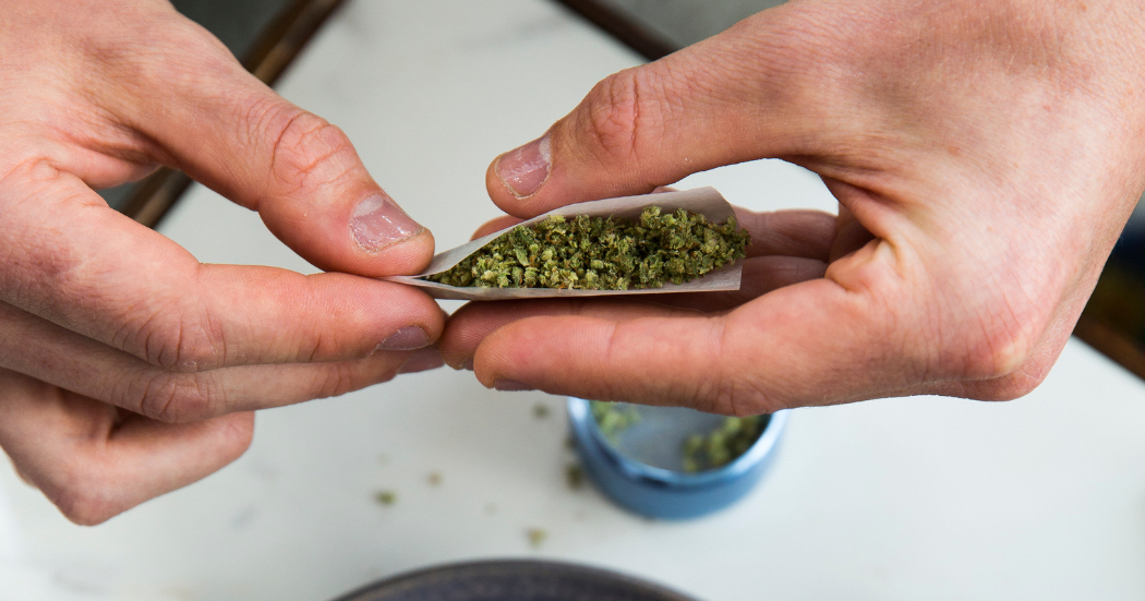 Rolling an infused joint.